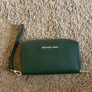 Michael Kors wristlet/wallet. Forest green with gold lettering